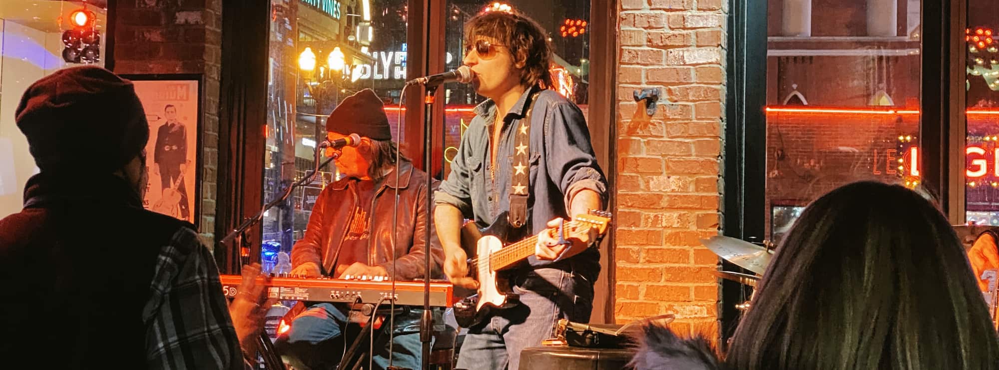 bar singer on guitar in East Lansing